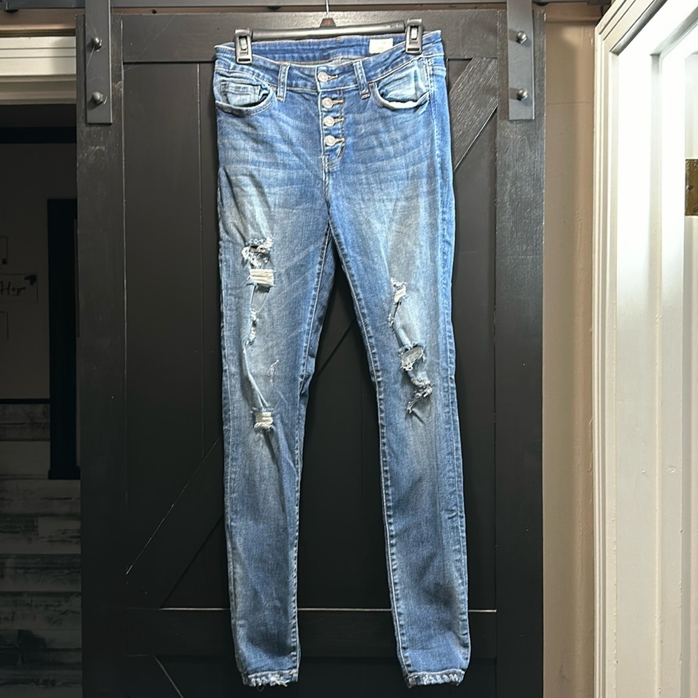 Distressed mid rise skinny jeans